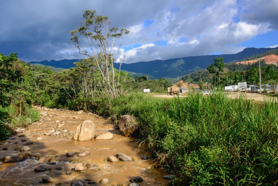 The Rio Wawayme , choked with sediment from construction of roads and infrastructure for the Mirador Mine, flows past a camp being built for mine workers, December 8, 2015. Photo by Beth Wald.